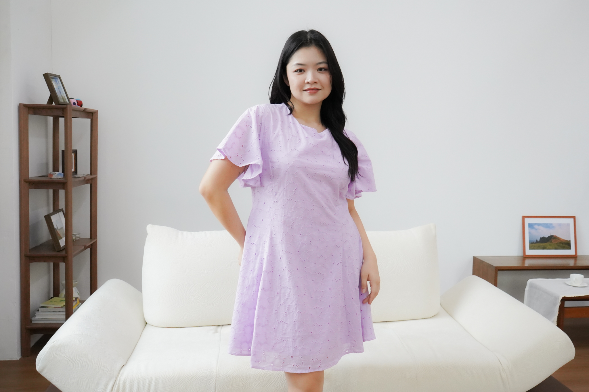 Model wearing a lavender eyelet dress from The Fleur Label